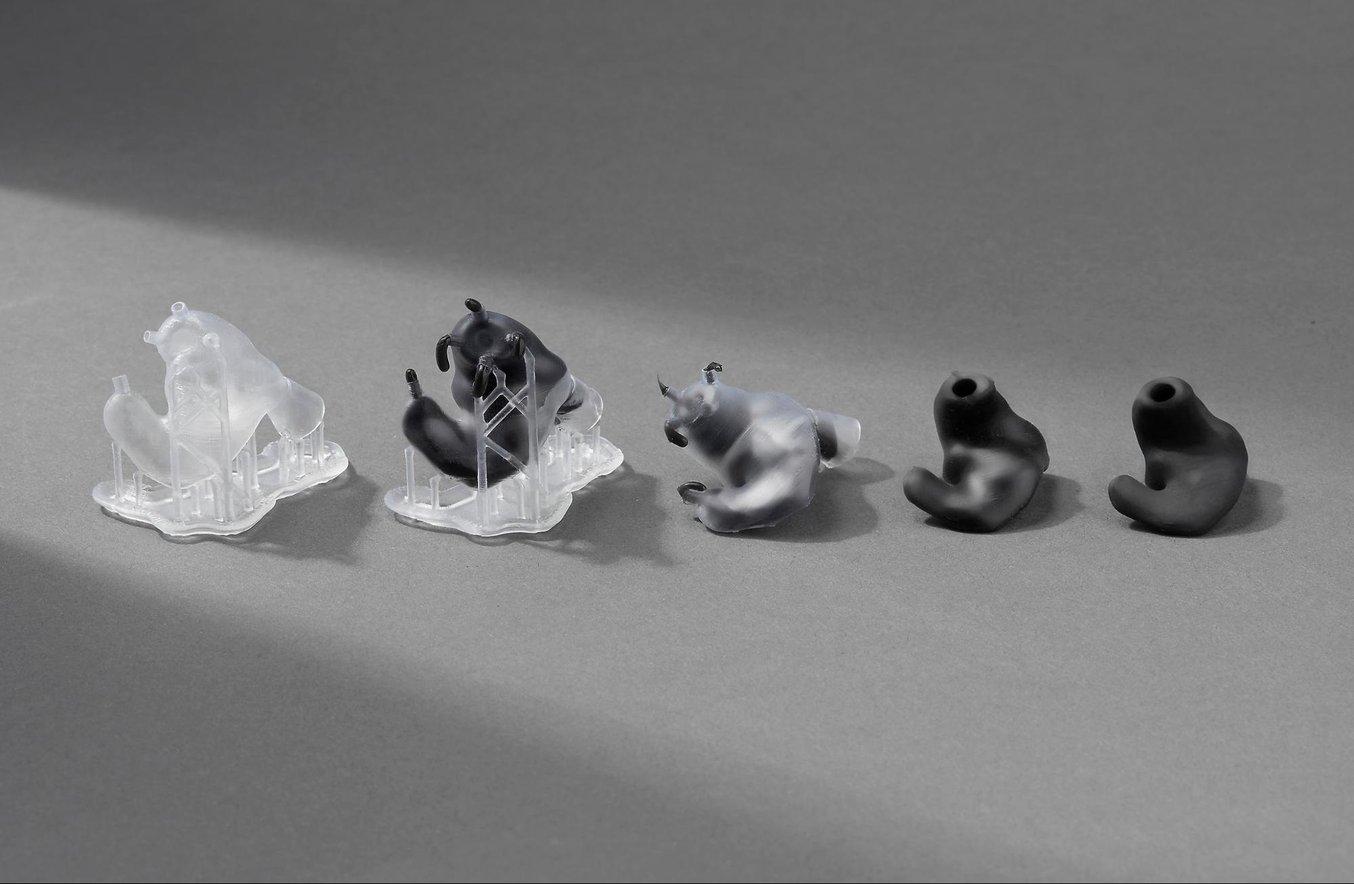 Custom earbuds are made by casting biocompatible silicone in 3D printed hollow molds. Each printed mold costs $0.40 to $0.60 in resin, and the overall production of a final pair of earbuds costs approximately $3 to $4 in raw materials.