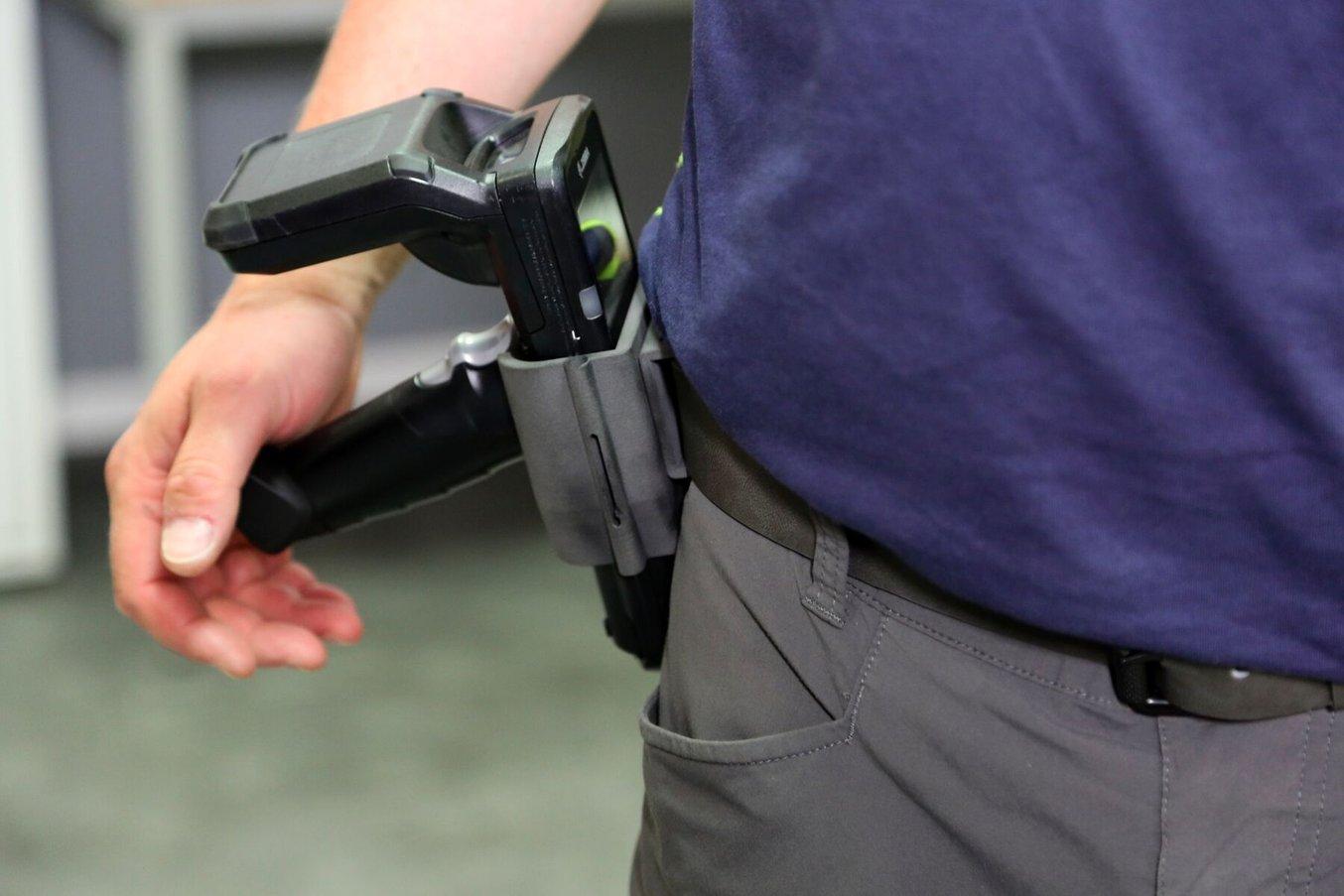 Employees in materials management needed a way to mount handheld scanners, so they could keep them close by without continuously occupying one of their hands.