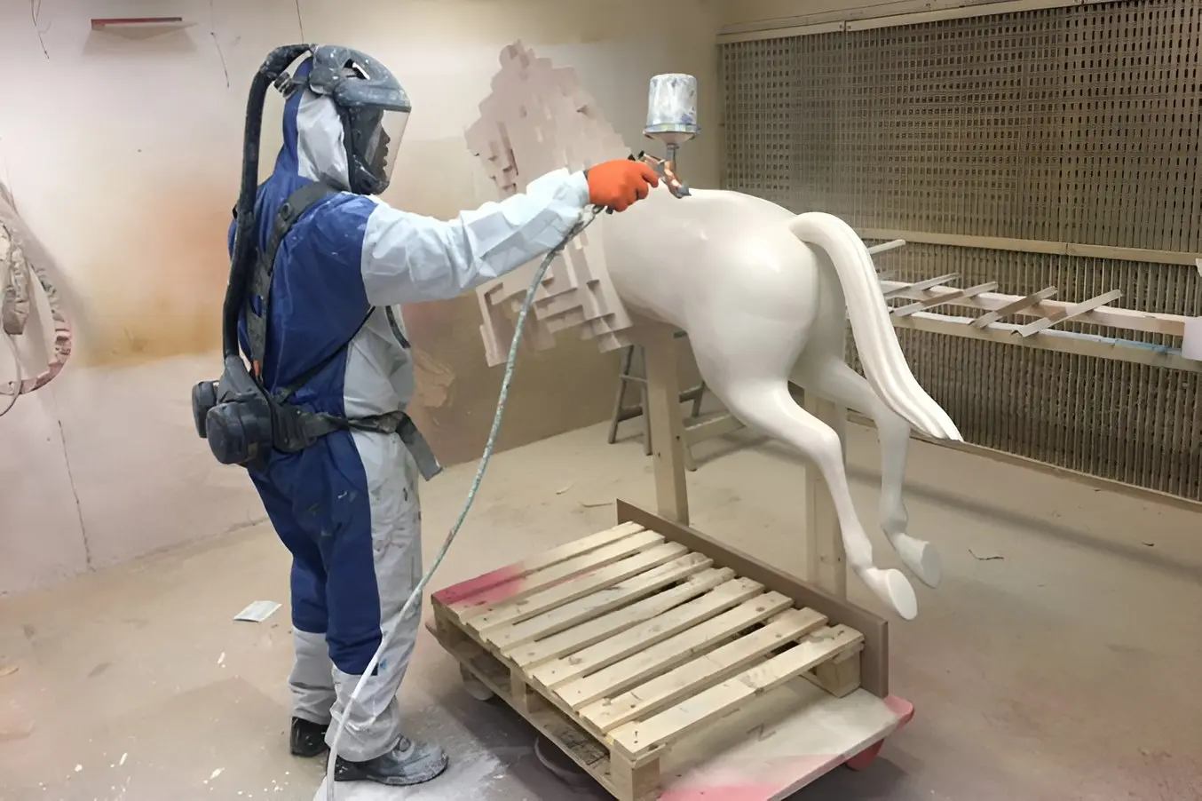 A 3D printed horse getting spraypainted