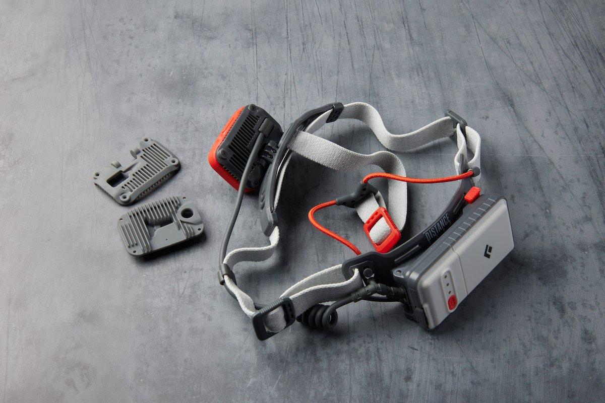 3D printed components of a headlamp in grey resin and a Black Diamond headlamp