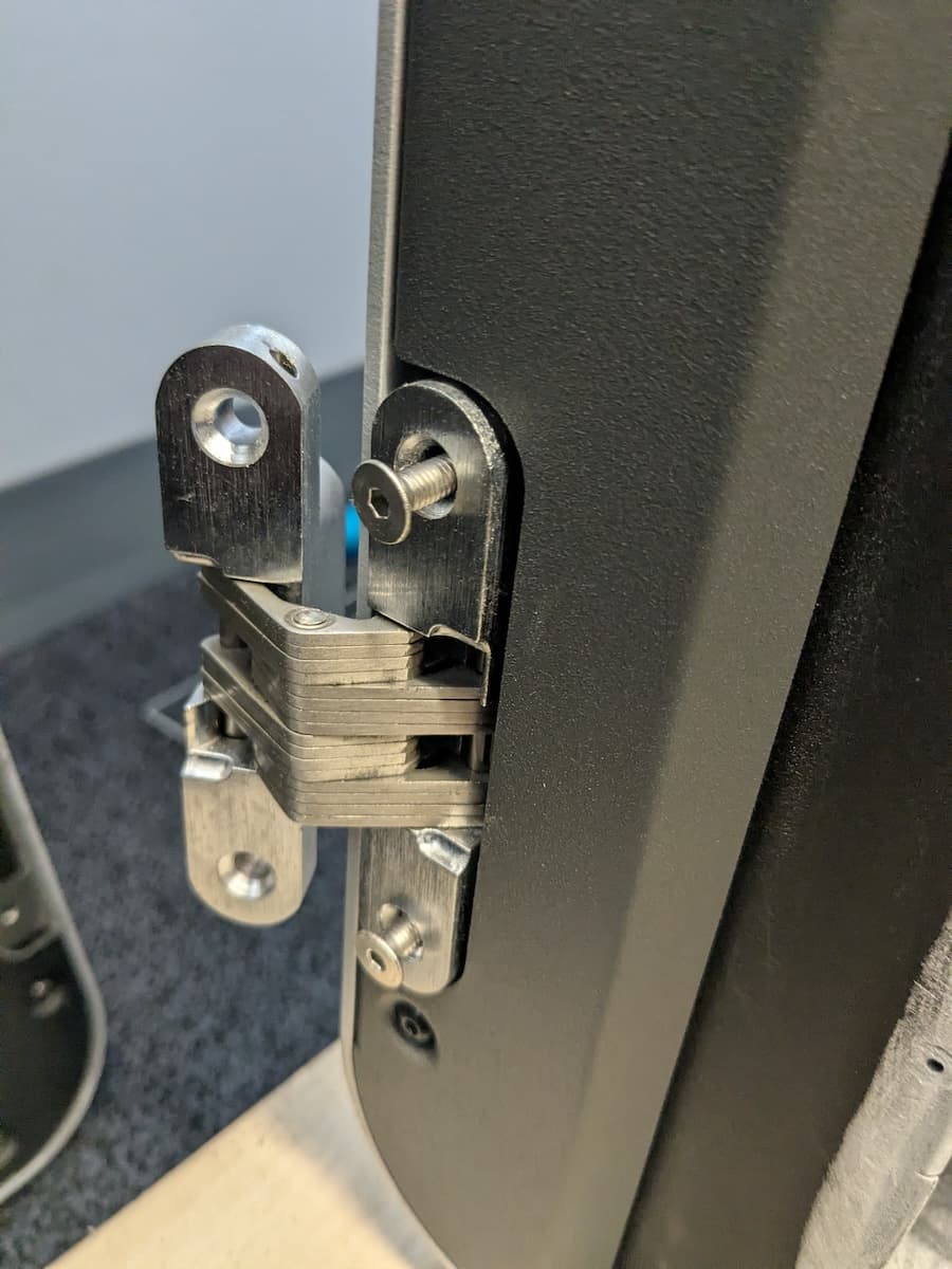 Step 3: Remove the hinge mounting screws from the printer