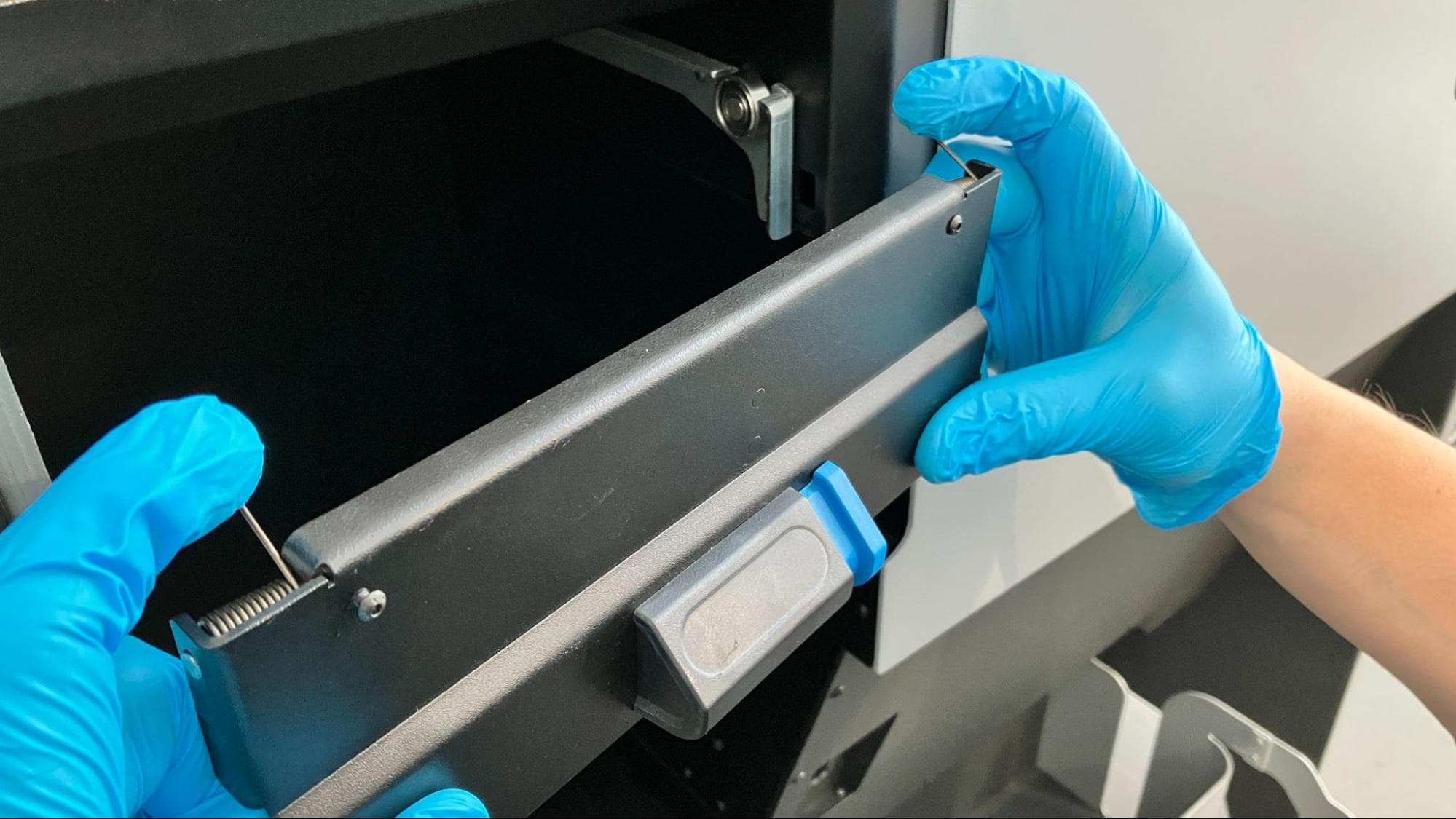 Install the new build chamber latch assembly