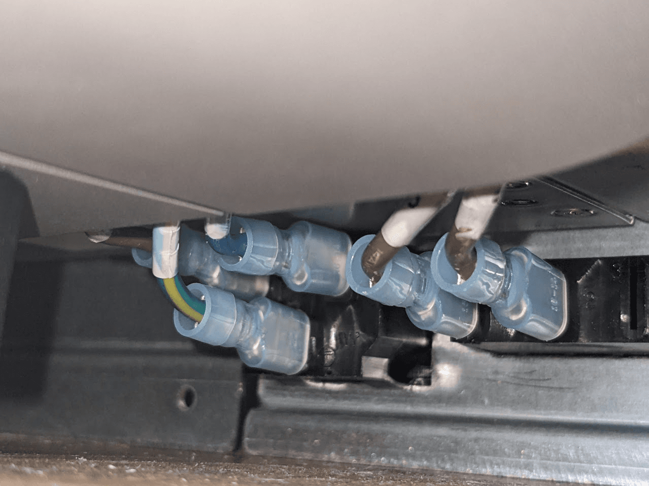 Ensure the cables attached to the power switch and cable harness are fully seated and are not pinched between the power supply assembly and the printer frame.