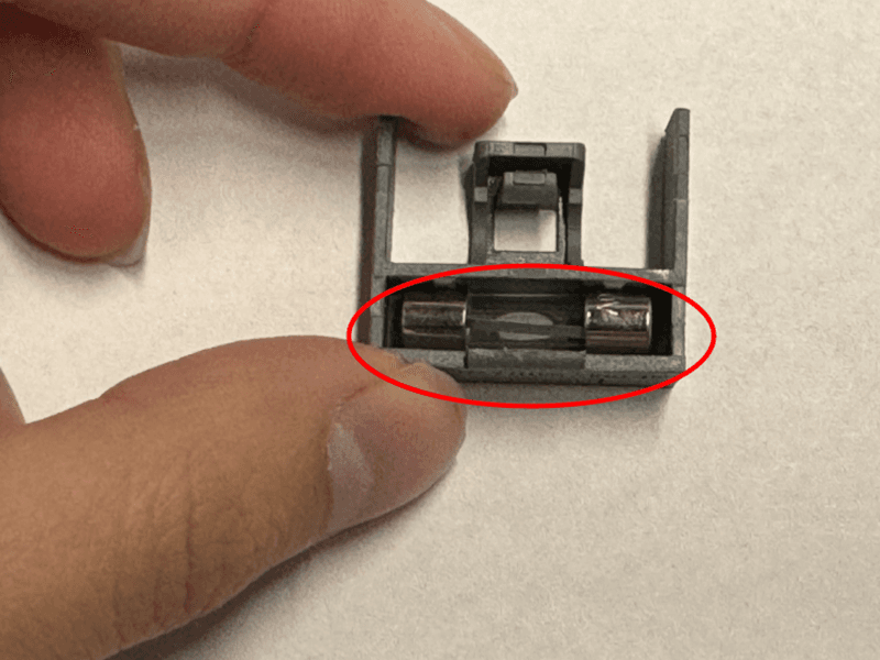 Gently push the replacement fuse into the fuse box.