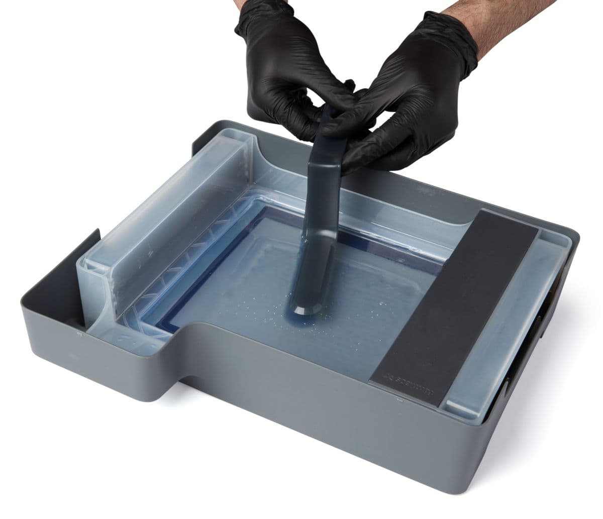 Tweezing cured resin with the tank tool