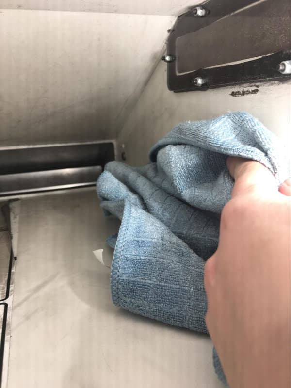 Wiping the inside of the Fuse 1's hopper with a microfiber cloth