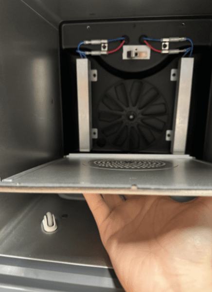 Remove the heater cover panel screws