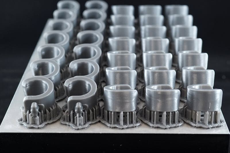 Seamline displayed in the middle row of hooks printed in Tough 2000 Resin.