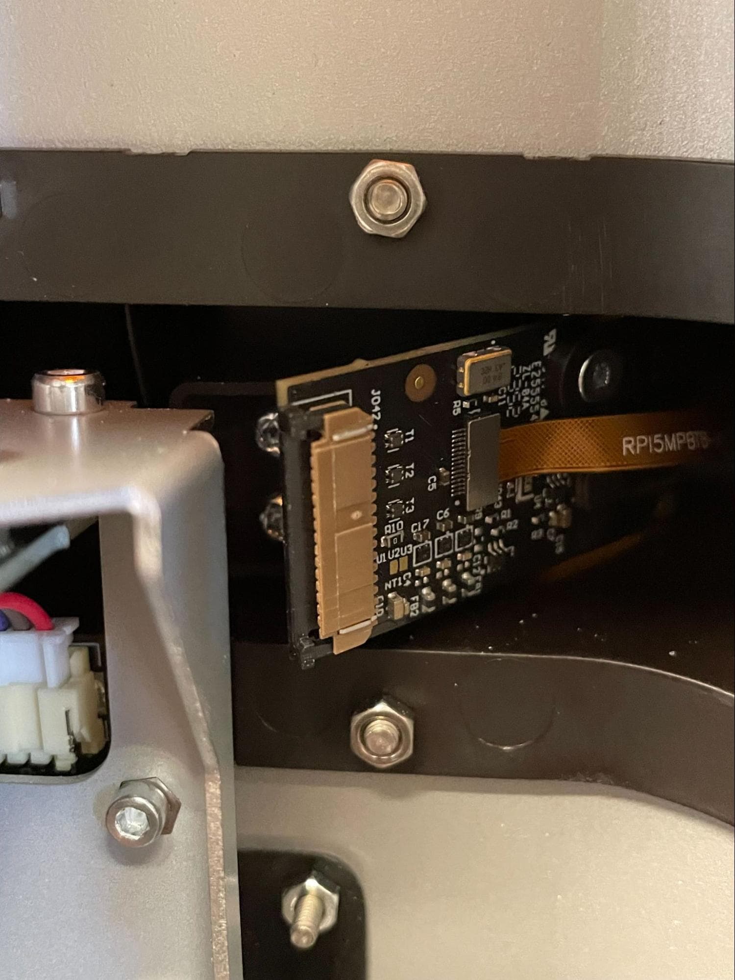 Remove the Form 4 camera mounting screws