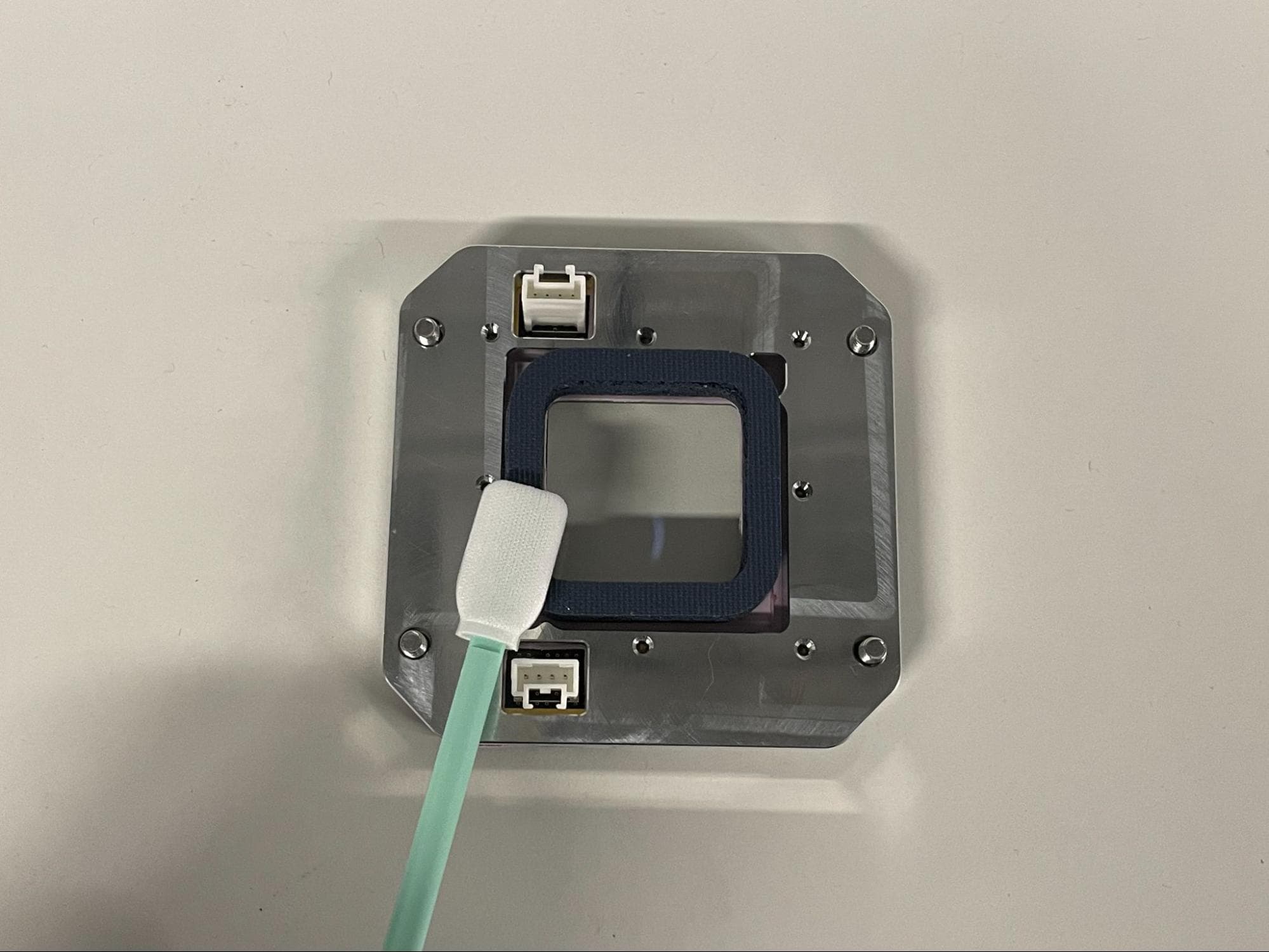 Install the new upper laser window