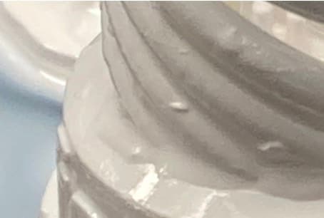 An example of debris left on the surface of a part printed in Alumina 4N Resin