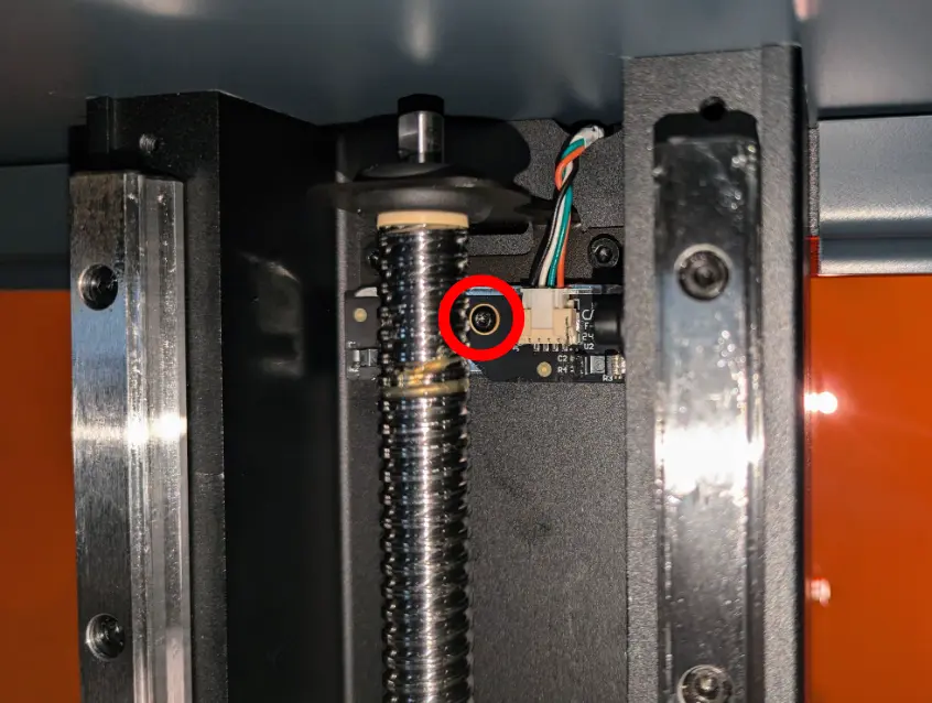 Remove the Z-axis limit switch retention screw