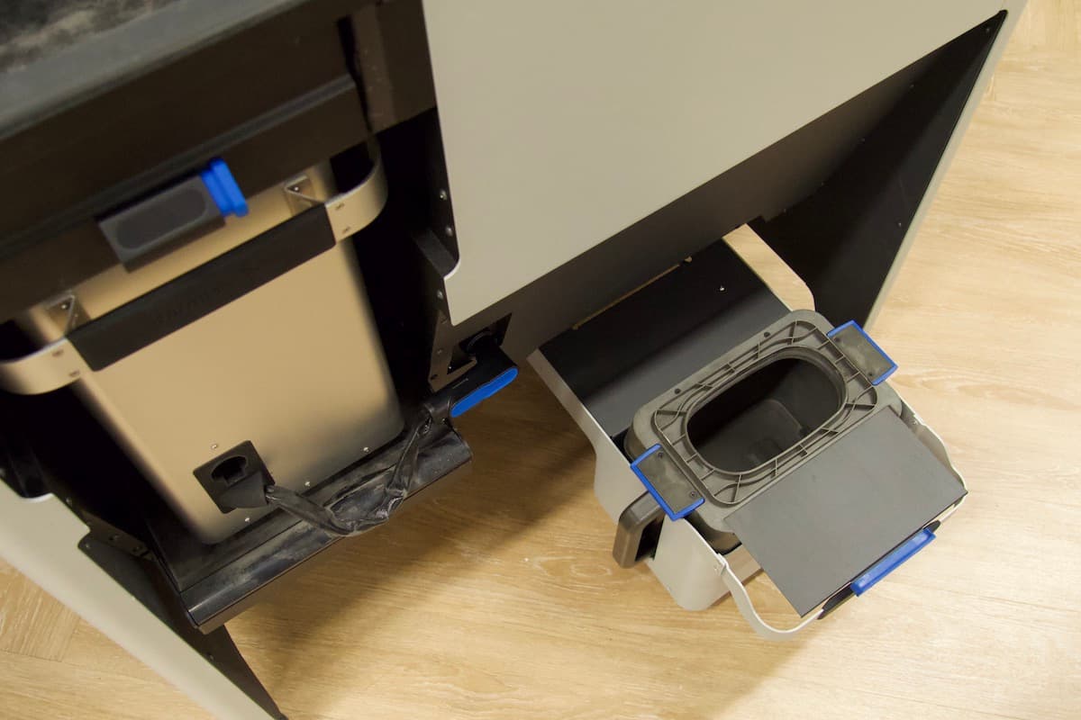 The Fuse Sift's opened cartridge drawer with an empty powder cartridge
