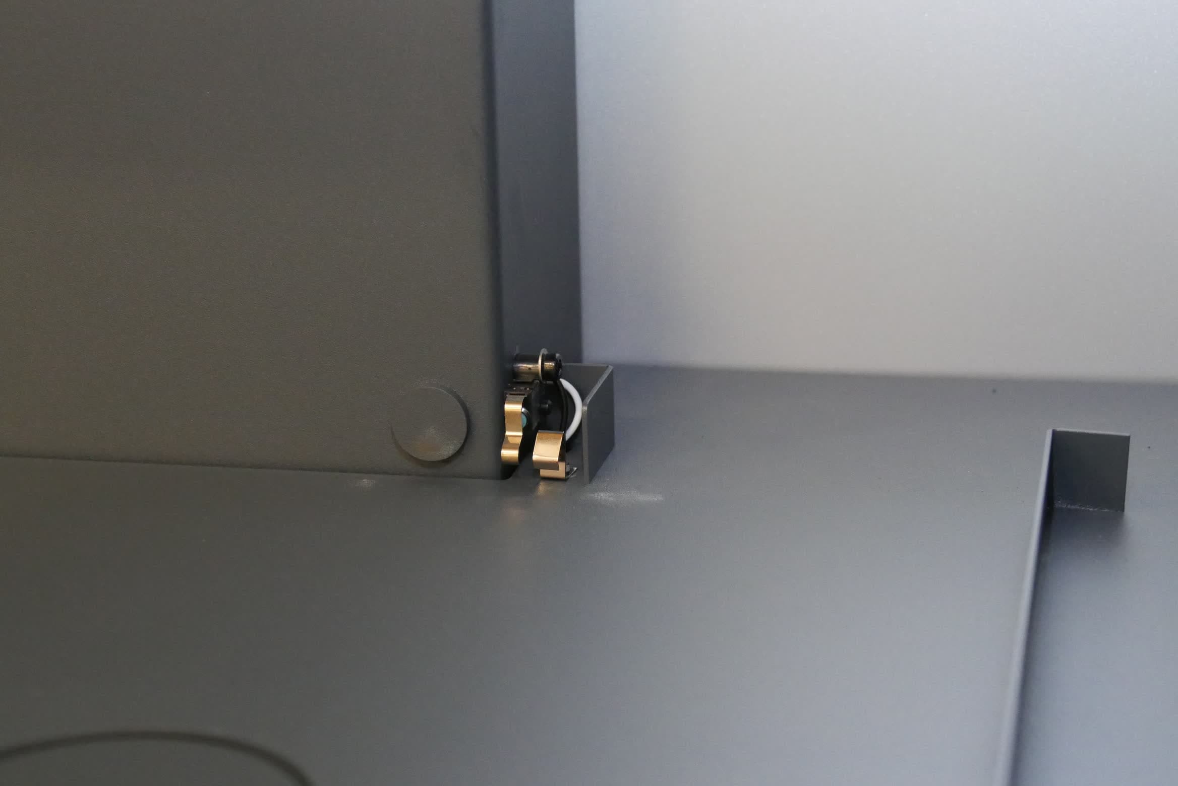 Wash bucket interlock switch, viewed from the front