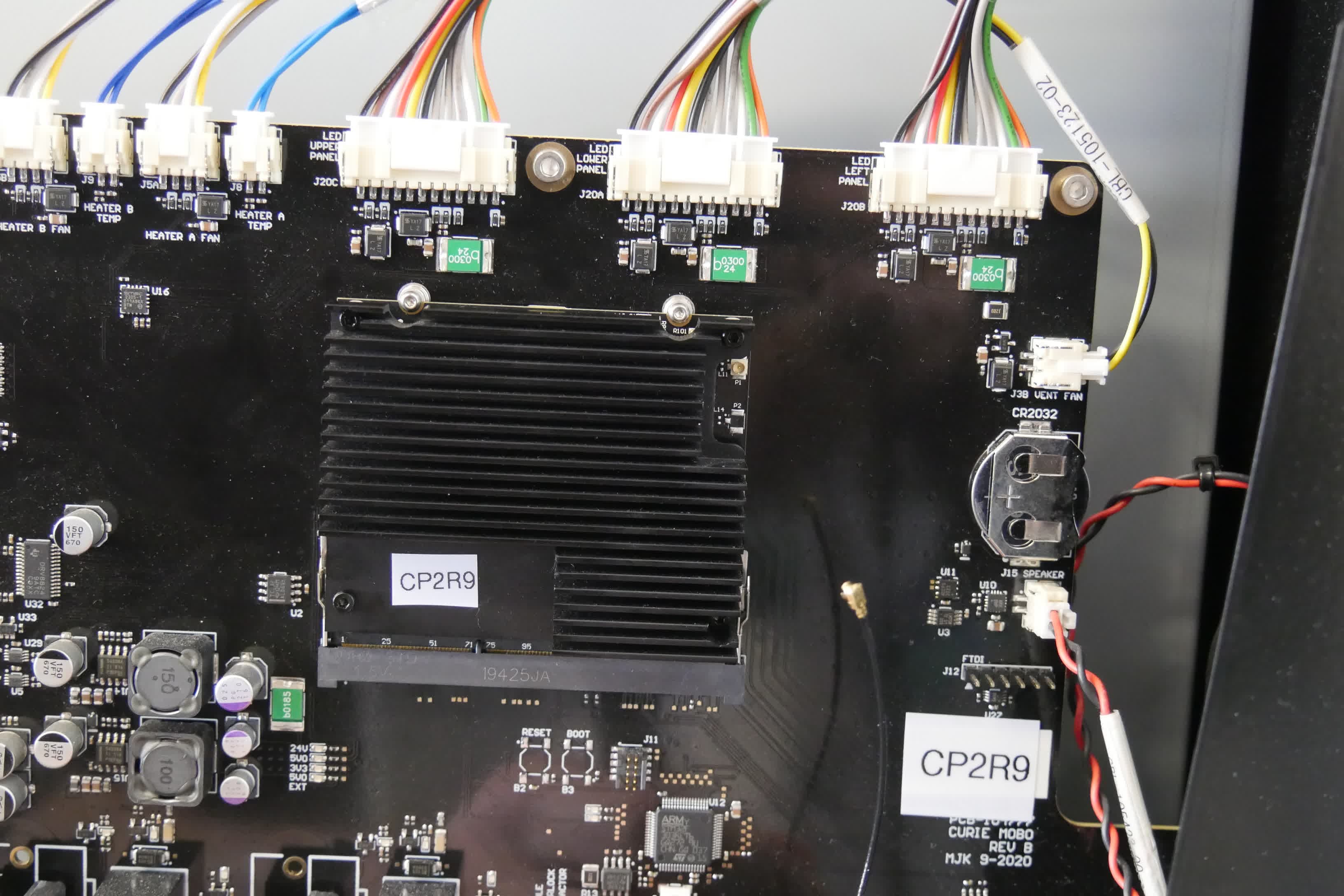 Unplugging the Form Wash L Wi-Fi antenna from the SOM