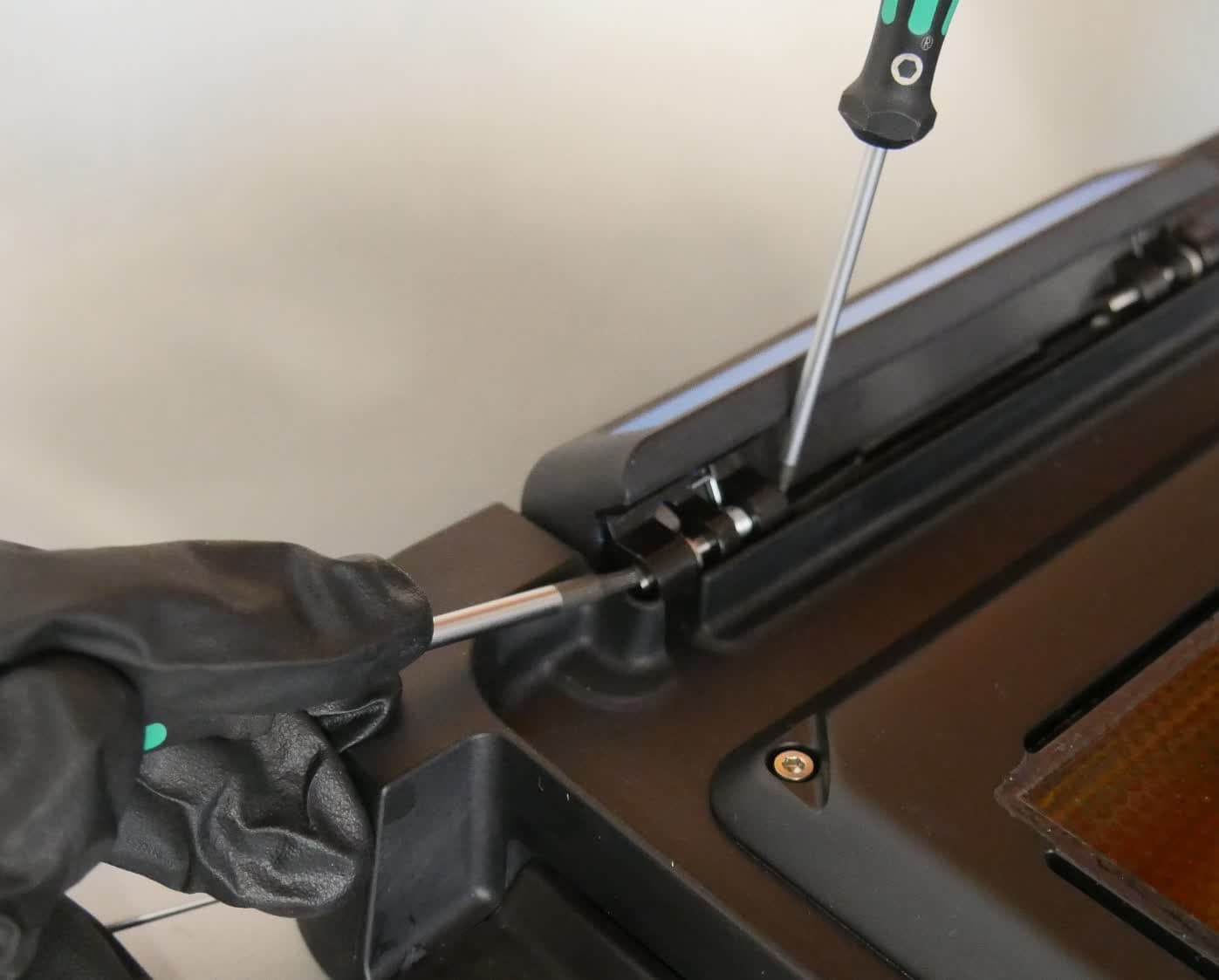 Step 2: Remove the pin and spring