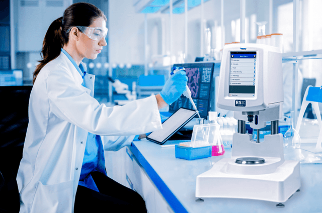 a woman works in a laboratory