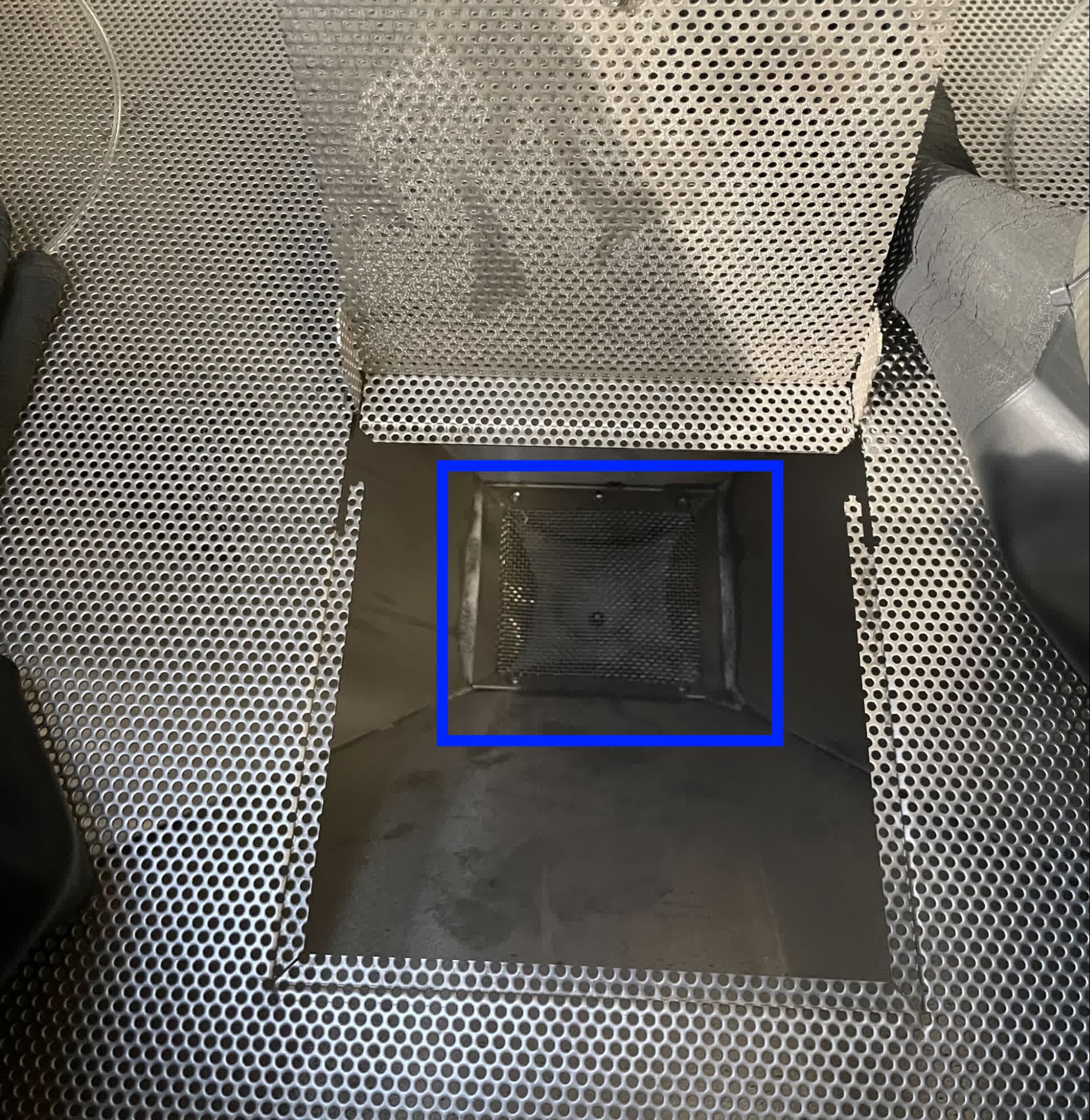 Step 3: Lift the grate to access the catch chute