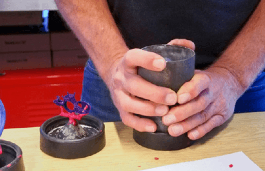 Attach a casting flask to the sprue base.