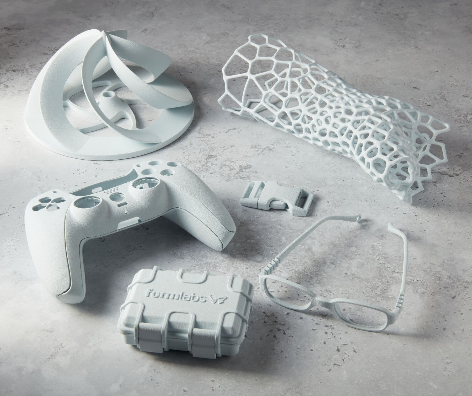 A collection of parts 3D printed in Nylon 12 White Powder