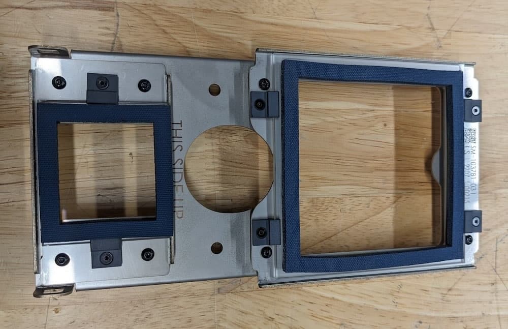 A clean optical cassette without streaks sits on a wood surface after a cleaning