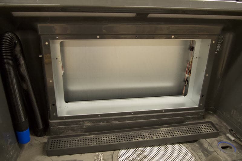 The back panel sits empty without a grate or filter