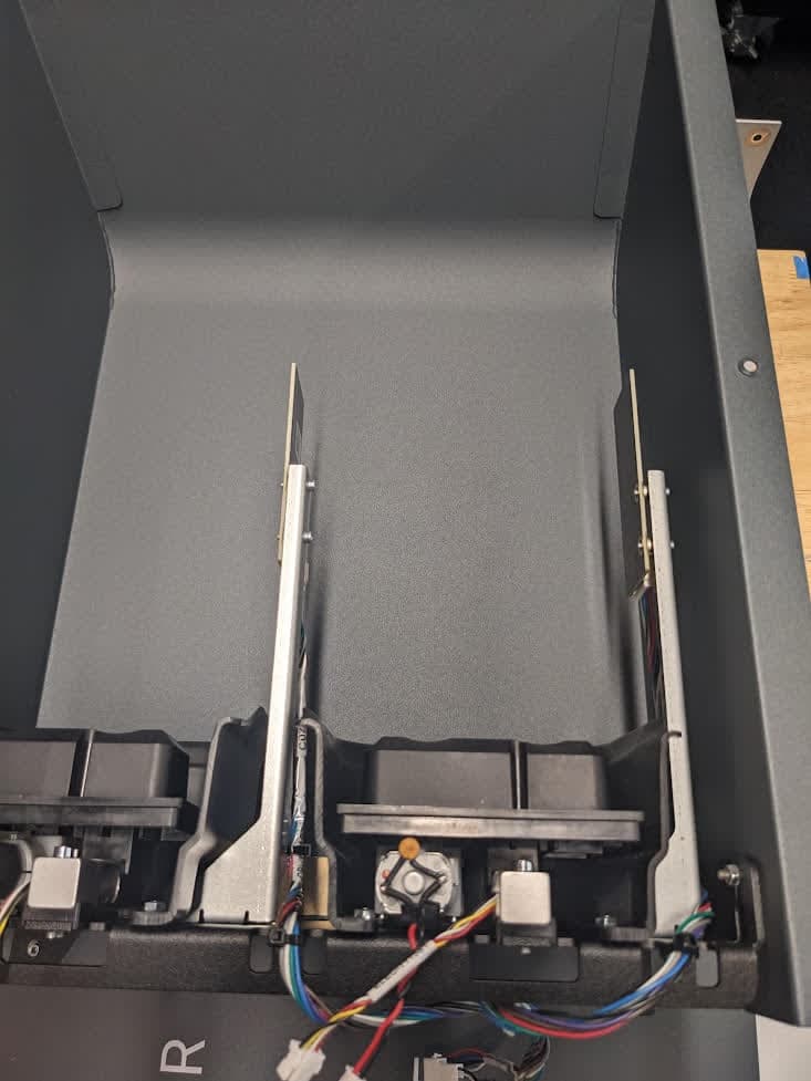 Remove the cartridge cavity assembly screws
