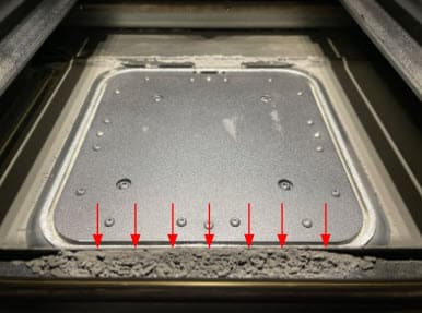 Powder buildup on an overdosing printer
