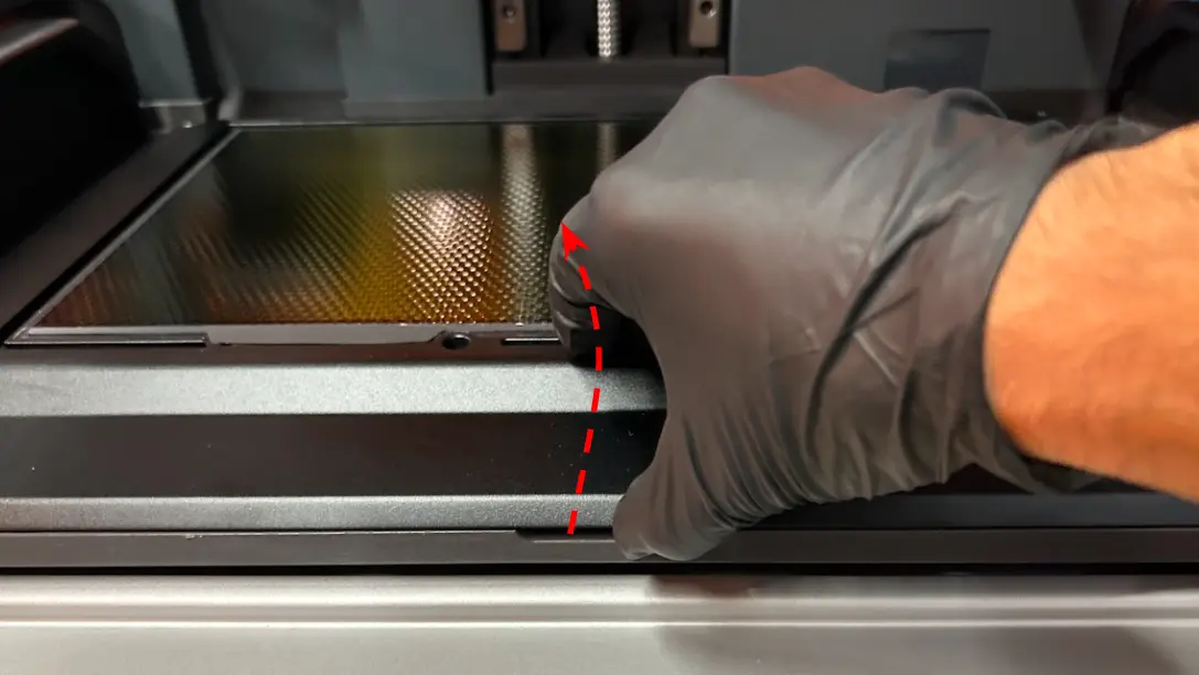 Carefully lift the LPU and tilt it so that the bottom faces you.