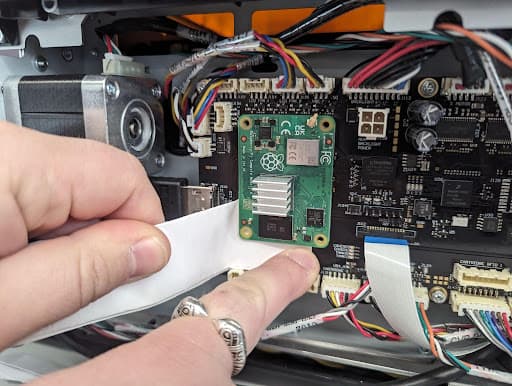 Disconnect the left side of the SOM from the motherboard