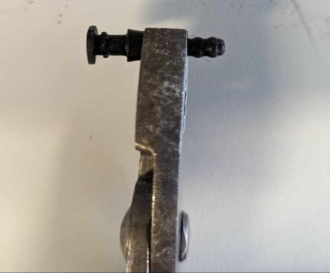 Gripping the upper LPU fan mounting pin with needle nose pliers