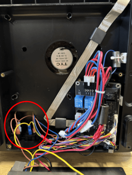 Route the motor cable through the slot at the bottom of the internal panel.