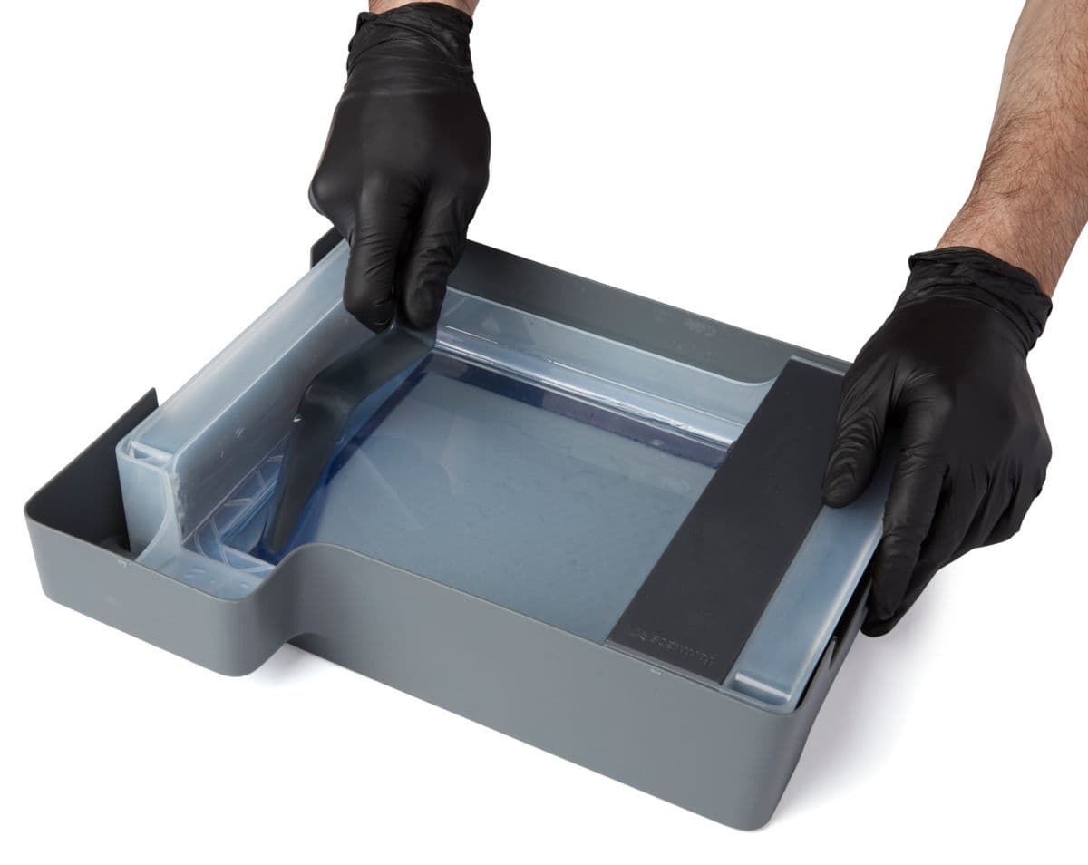 Scraping cured resin with the tank tool