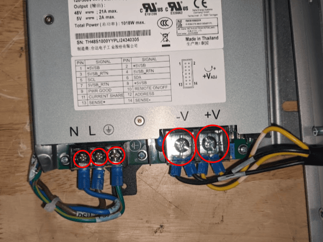 Remove the power supply screw terminal screws