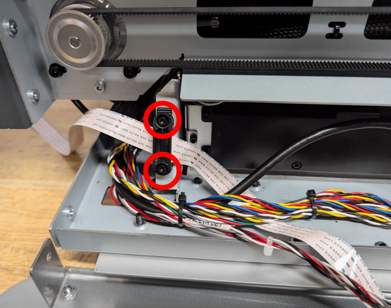 Release the ribbon cable clamps