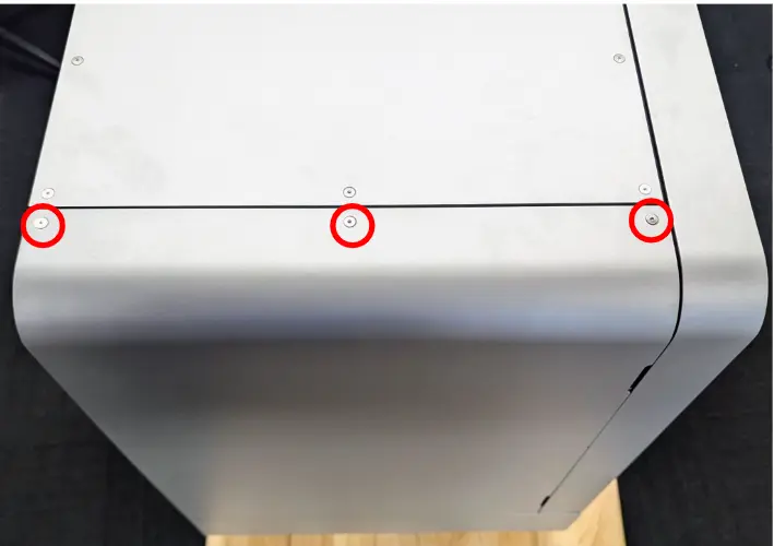 Three upper left panel top retention screws