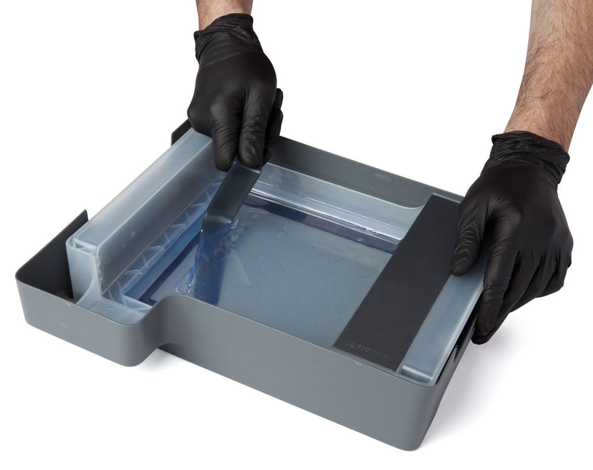 Scraping cured resin with the tank tool