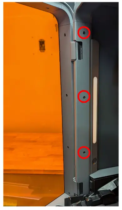 Three upper left panel retention screws, located inside the printer
