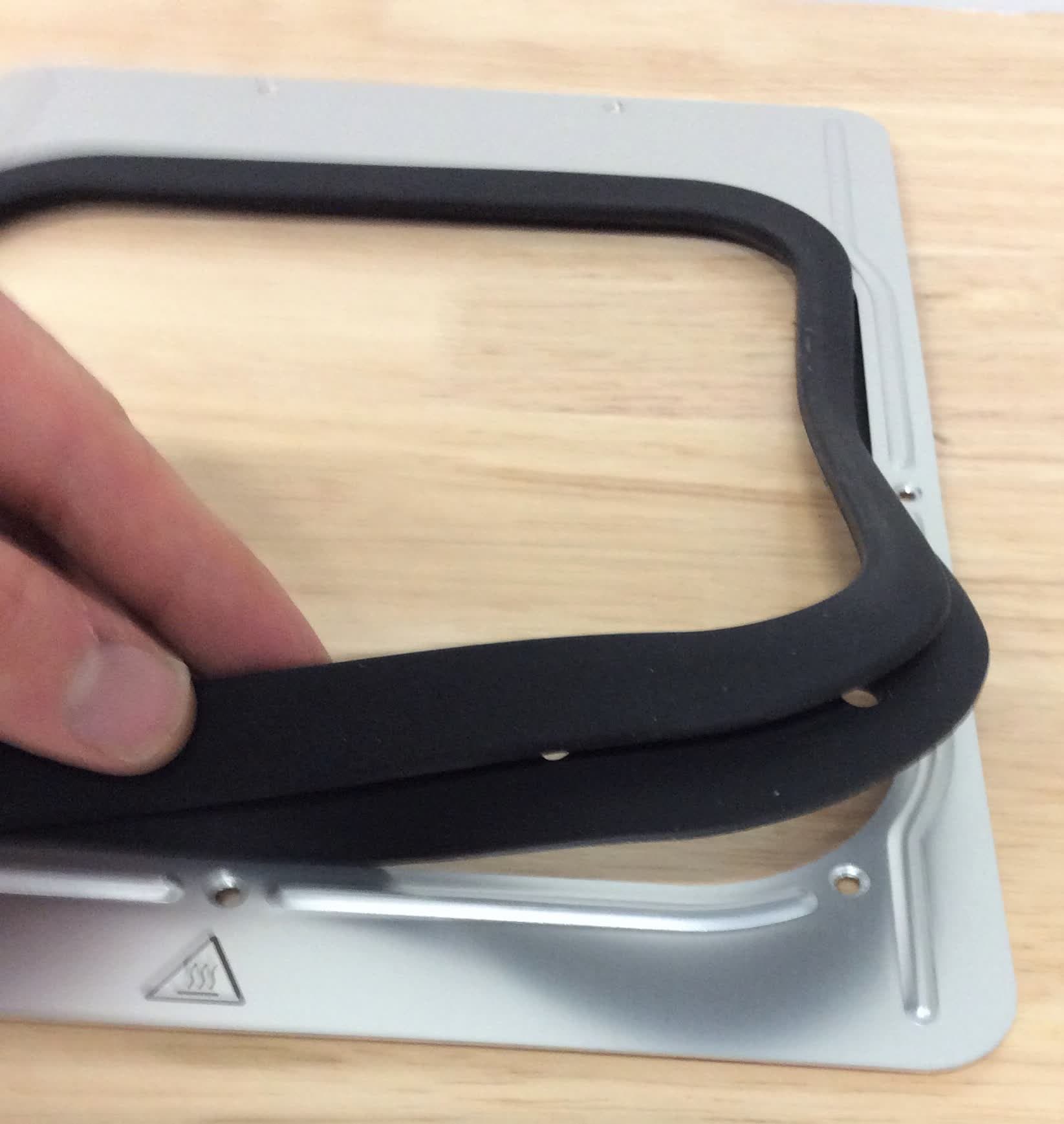 Installing the external frame gasket onto the top cover
