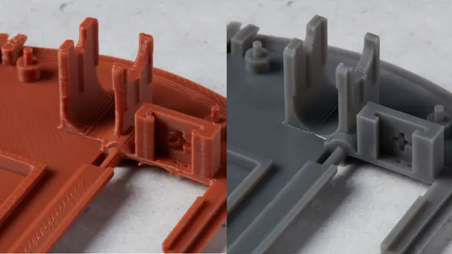 Side by side comparison of FDM (left) vs. SLA (right) 3D prints. Layer lines are evident on the FDM print.