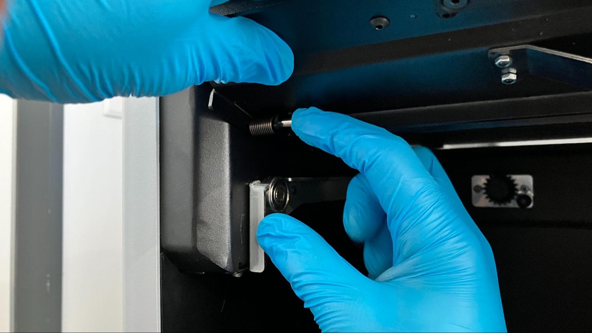 Install the new build chamber latch assembly