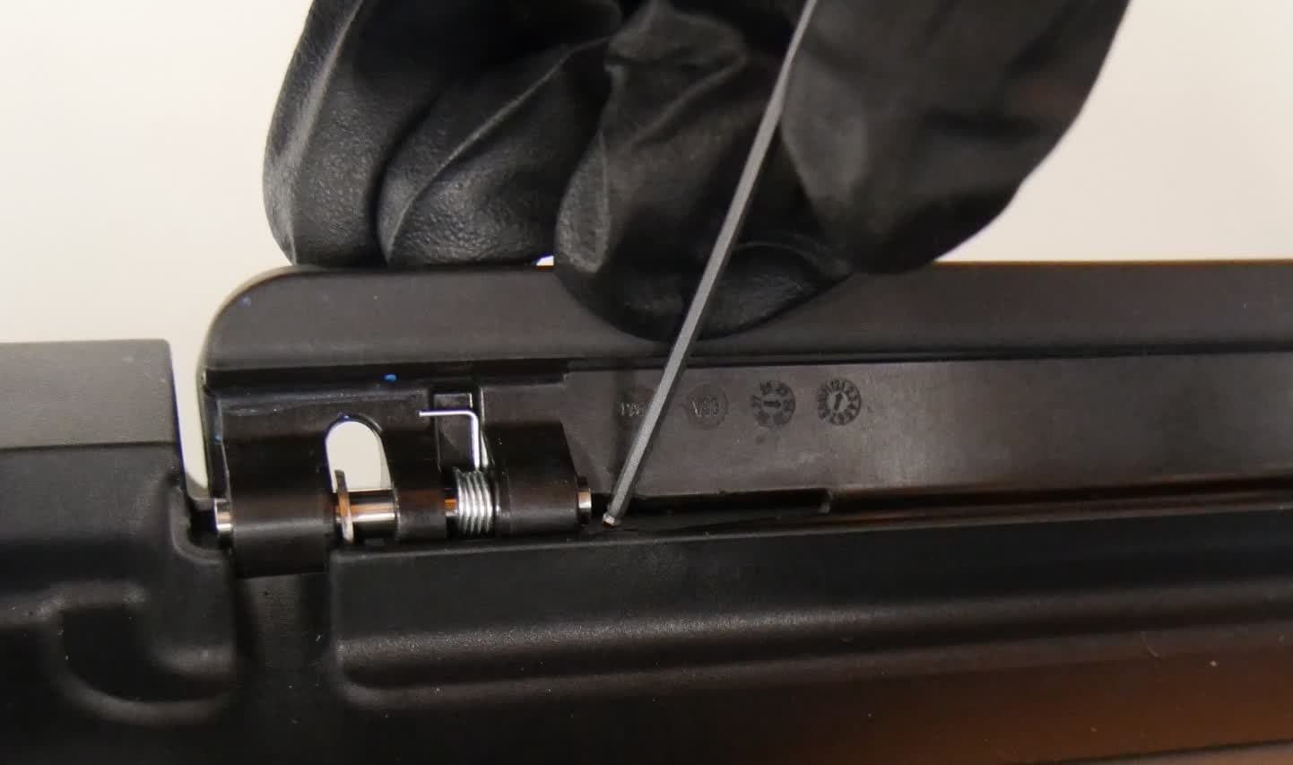 Step 1: Locate the retaining tab