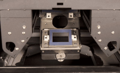 The cassette tray is open to reveal the optical cassette inside