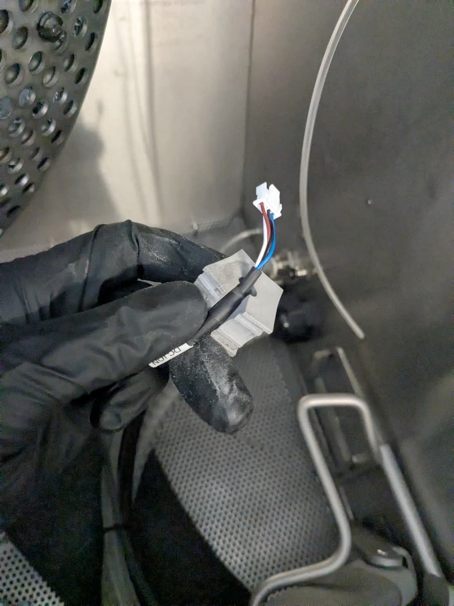 Step 2: Secure the ionizer cable in the clamp