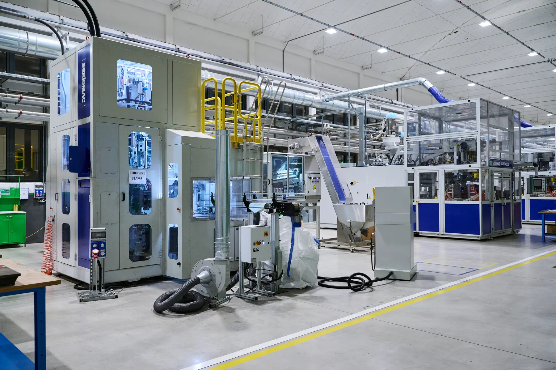 Industrial blow molding machines in Serioplast’s facility in Bergamo, Italy.