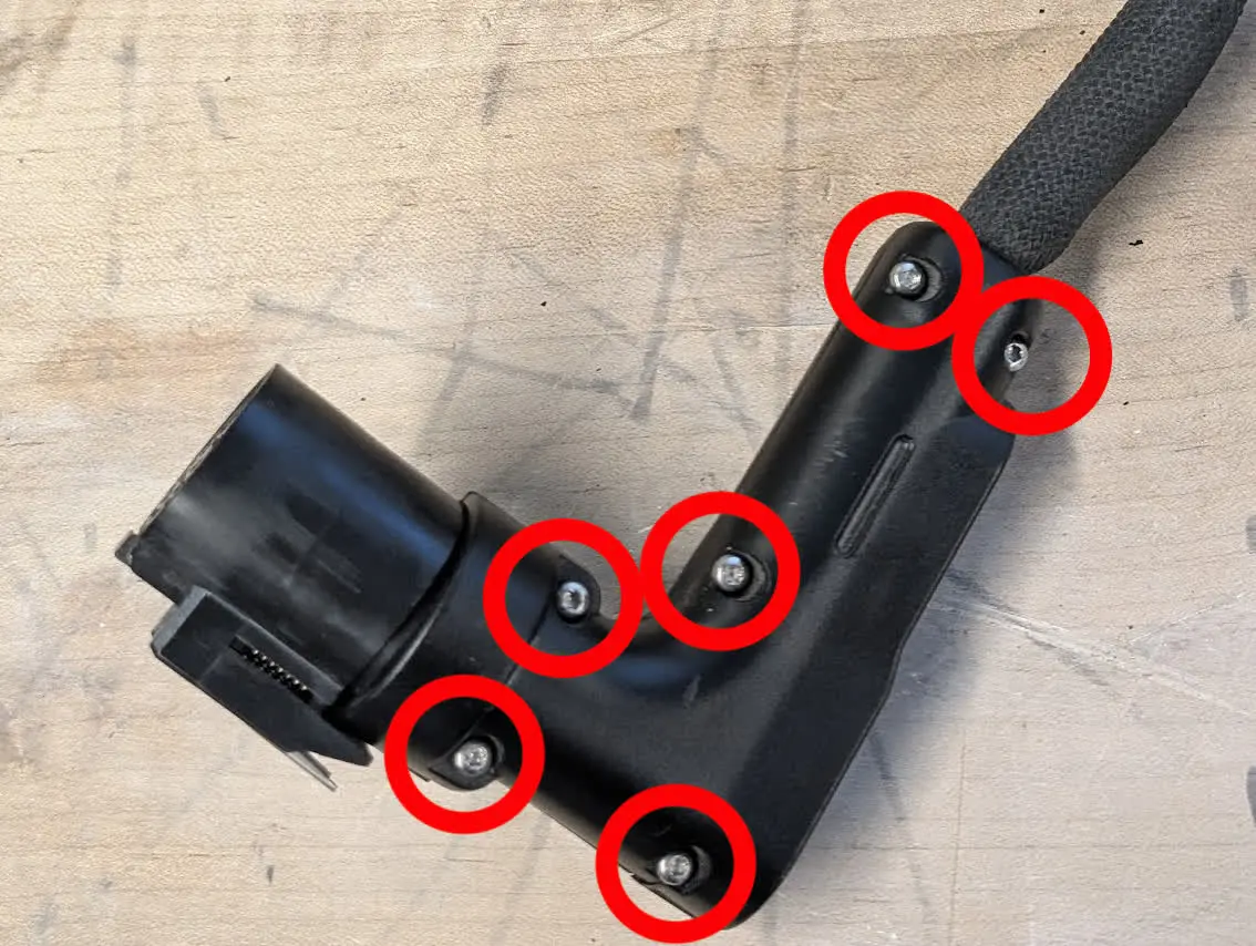 Step 1: Remove the build chamber plug case screws