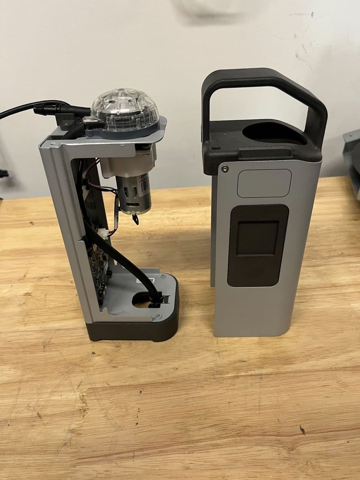 Pull the handle straight up, away from the base of the resin pump, to separate the shell from the body.