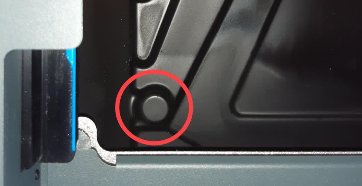 Front-left leveling foot access hole in the Form 3L drip tray