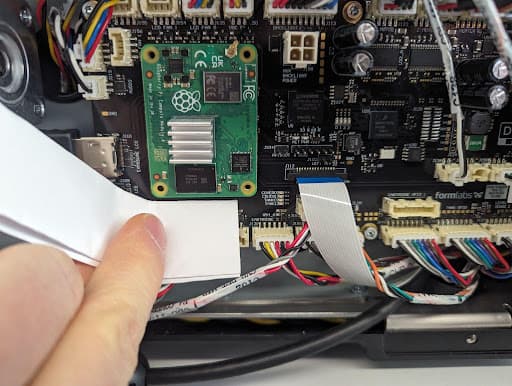 Disconnect the left side of the SOM from the motherboard
