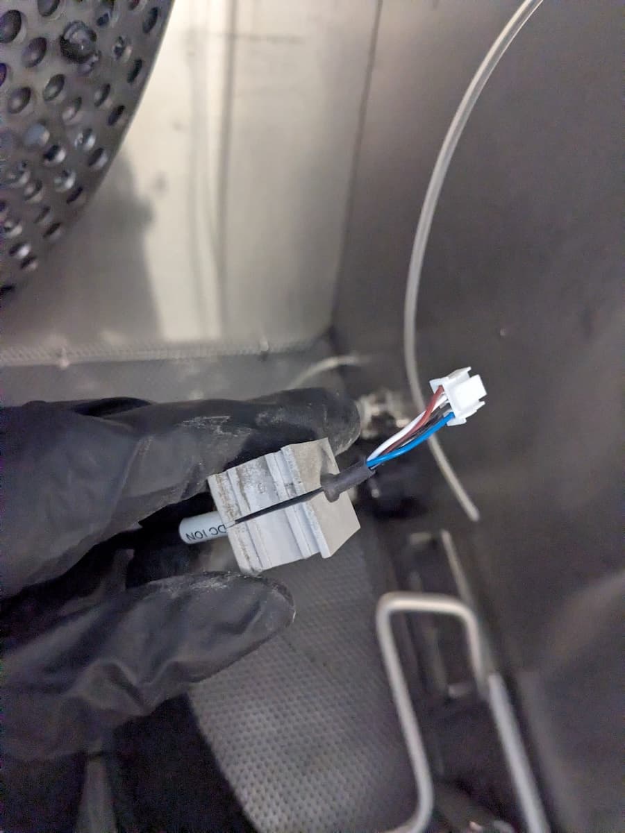 Step 2: Secure the ionizer cable in the clamp